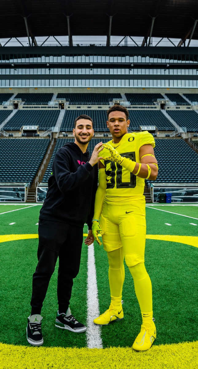 Jaxson Jones poses for a photo inside Autzen Stadium.